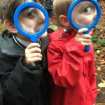 Reception boys with magnifying glass